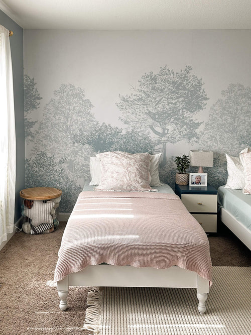 Hua Trees Blue Mural Wallpaper behind table and chair Sian Zeng