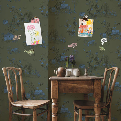 khaki green and blue moody enchanted forest magnetic wallpaper as noticeboard in kitchen with magnets and children's drawings