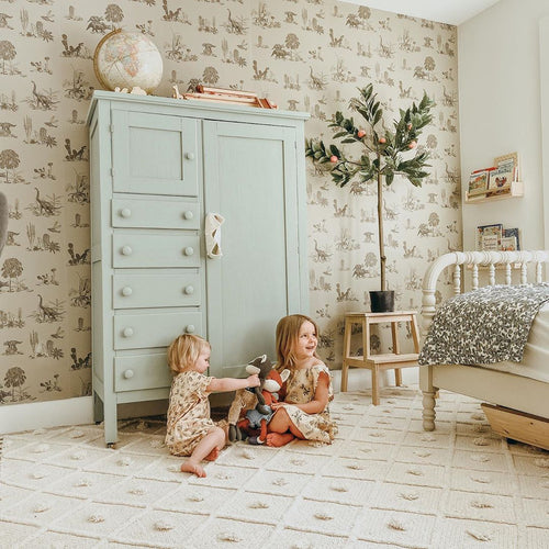 neutral coloured illustrated dinosaur wallpaper by Sian Zeng in situ