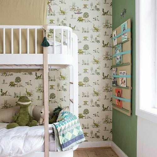 yellow and green dinosaurs magnetic wallpaper for children's rooms with boy playing explorer