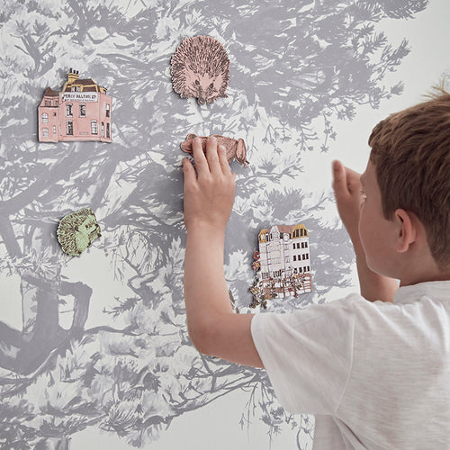 grey trees forest magnetic wallpaper mural with little boy playing with magnets on wall surface
