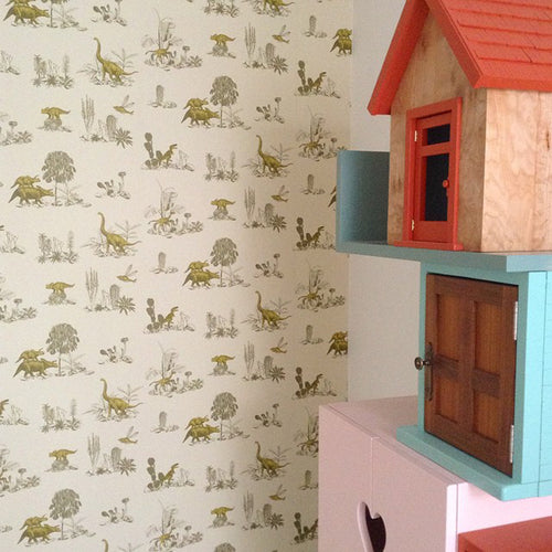 yellow and green dinosaurs magnetic wallpaper for children's rooms with boy playing explorer