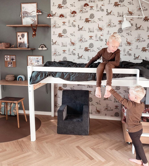 Papel de parede de dinossauros estilizado com flores e mesa vintage cinza