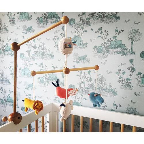 light blue enchanted forest magnetic wallpaper used as noticeboard in home office with magnets holding up note